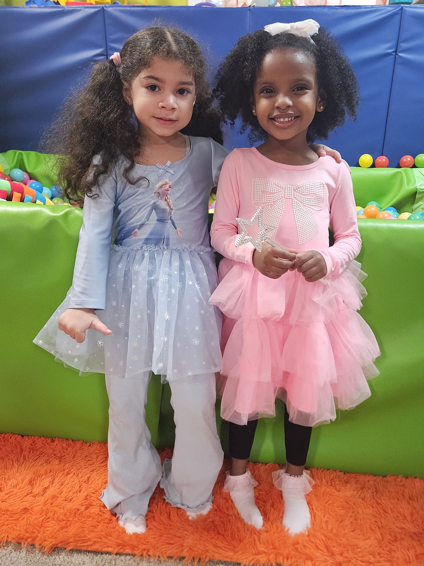Two happy children dressed up and smiling at Occupational Fun Edu-Childcare